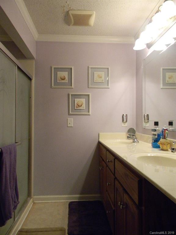 416 Willow Road Salisbury, NC 28147 - Photo 10 of 19 a bathroom with a sink a vanity and a mirror