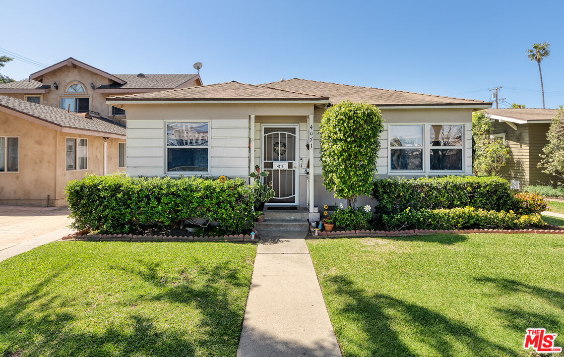 4071 Irving Place Culver City, CA 90232 - Photo 1 of 5 a front view of a house with a yard