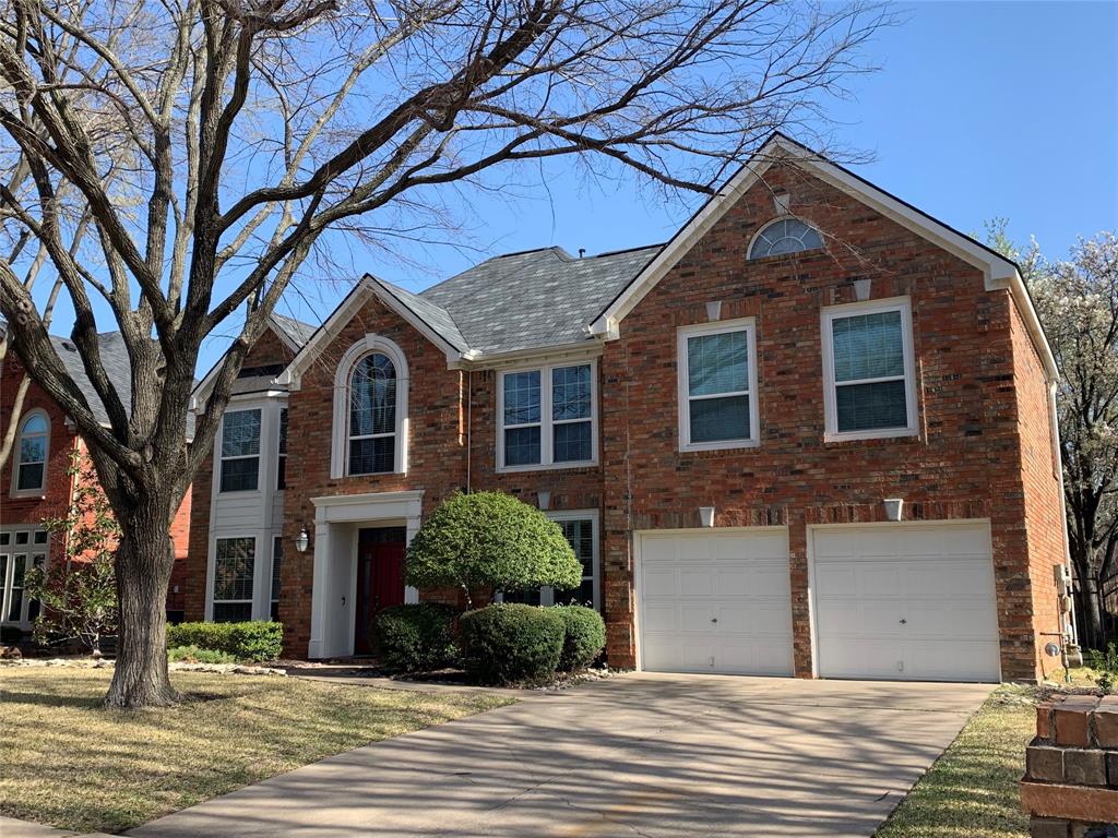 1920 Waterford Drive Grapevine, TX 76051 - Photo 1 of 1 View of front of house featuring an attached garage, brick siding, and concrete driveway