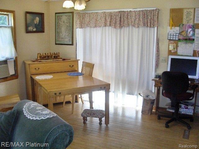 5887 North Latson Road Howell, MI 48855 - Photo 8 of 10 DINING AREA W/PATIO DOOR TO DECK