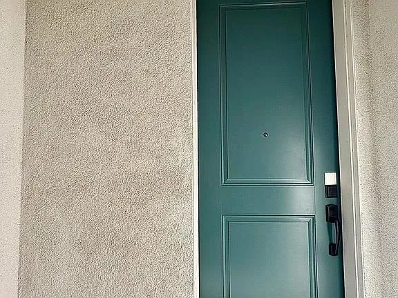 a kitchen with stainless steel appliances a stove and wooden floor