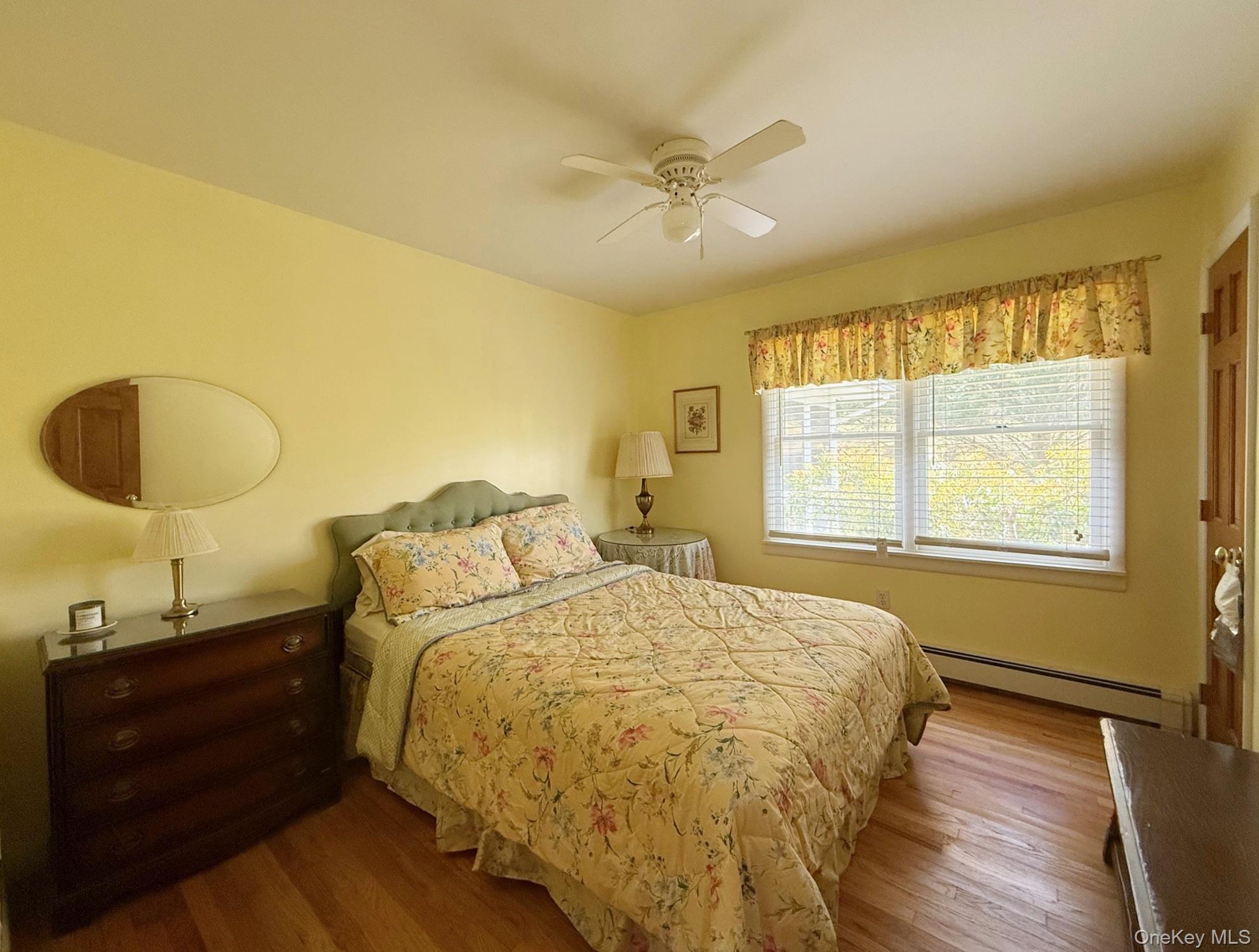230 Cooper Road Millerton, NY 12546 - Photo 14 of 20 a bed sitting in a bedroom next to a window and a mirror