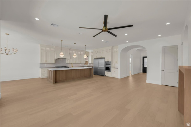 1620 Belayer Drive St. George, UT 84770 - Photo 10 of 51 Open-concept living space featuring wood-finish flooring throughout