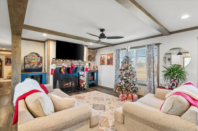 a kitchen with a table chairs a stove a dining table and chairs