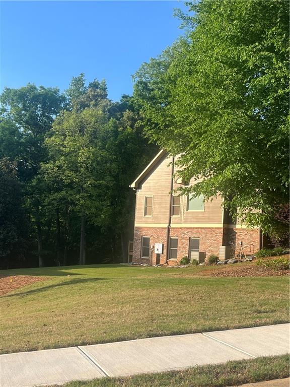 348 Hidden Trail Pendergrass, GA 30567 - Photo 7 of 40 a view of a house with a yard