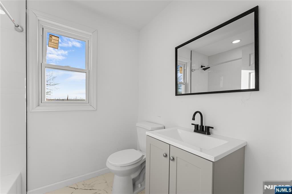 96 Prospect Terrace East Rutherford, NJ 07073 - Photo 18 of 31 a bathroom with a toilet sink and mirror
