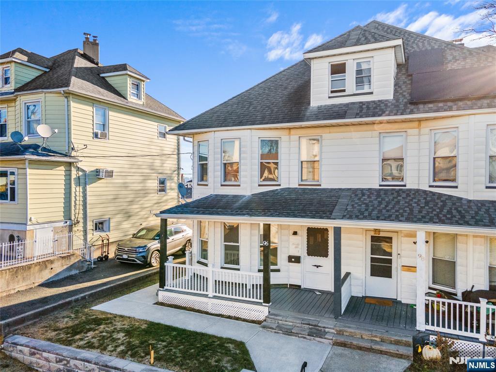 96 Prospect Terrace East Rutherford, NJ 07073 - Photo 2 of 31 a front view of a house with a yard