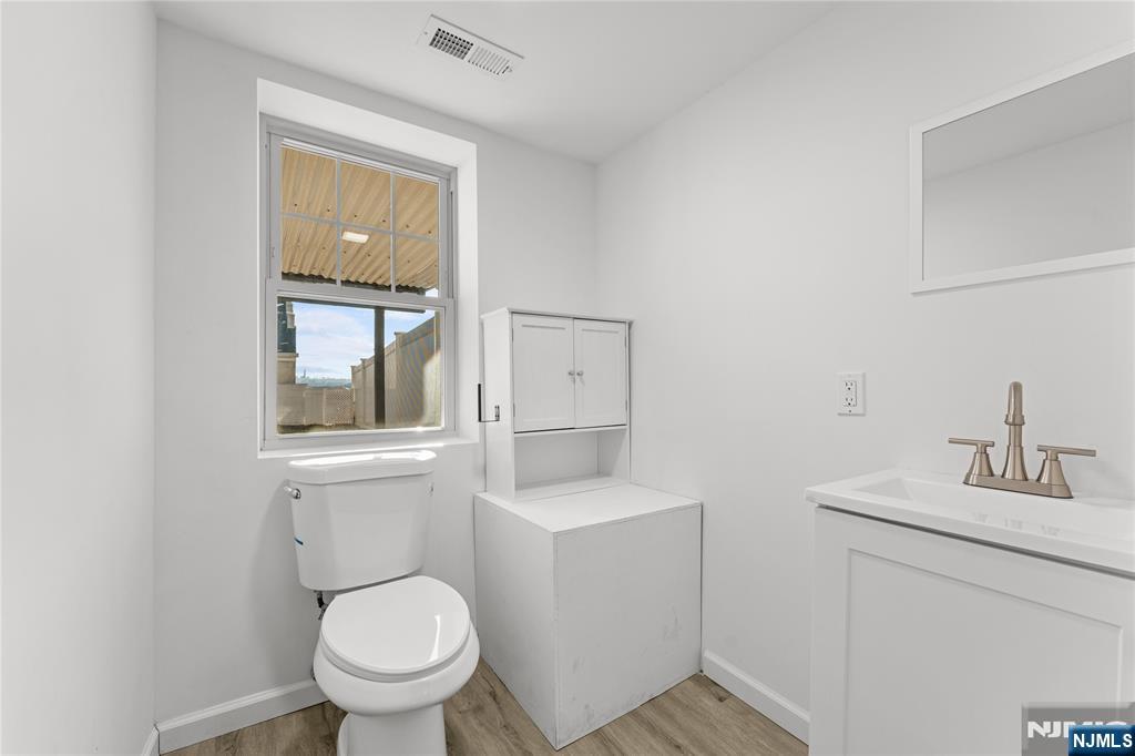 96 Prospect Terrace East Rutherford, NJ 07073 - Photo 25 of 31 a bathroom with a toilet sink and mirror