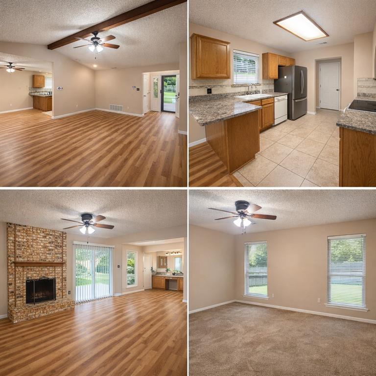 2127 Reverchon Drive Arlington, TX 76017 - Photo 3 of 3 Spacious open-concept living area featuring updated wood-look flooring, vaulted ceilings with decorative beam accents, and a cozy brick fireplace. Large open space offering an abundant natural light and views of the private backyard.