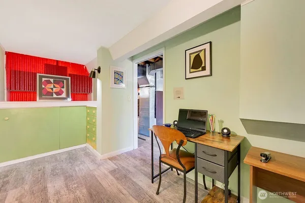 a view of a livingroom with furniture and a flat screen tv