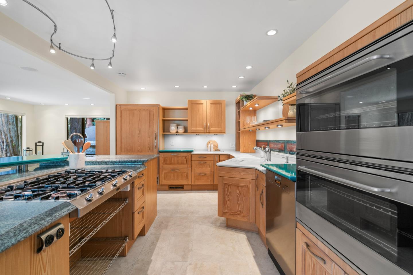 1695 Aptos Creek Road Aptos, CA 95003 - Photo 19 of 76 a kitchen with stainless steel appliances granite countertop a stove and a sink