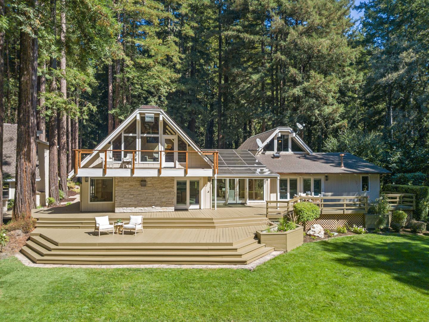 1695 Aptos Creek Road Aptos, CA 95003 - Photo 2 of 76 a front view of a house with a yard table and chairs