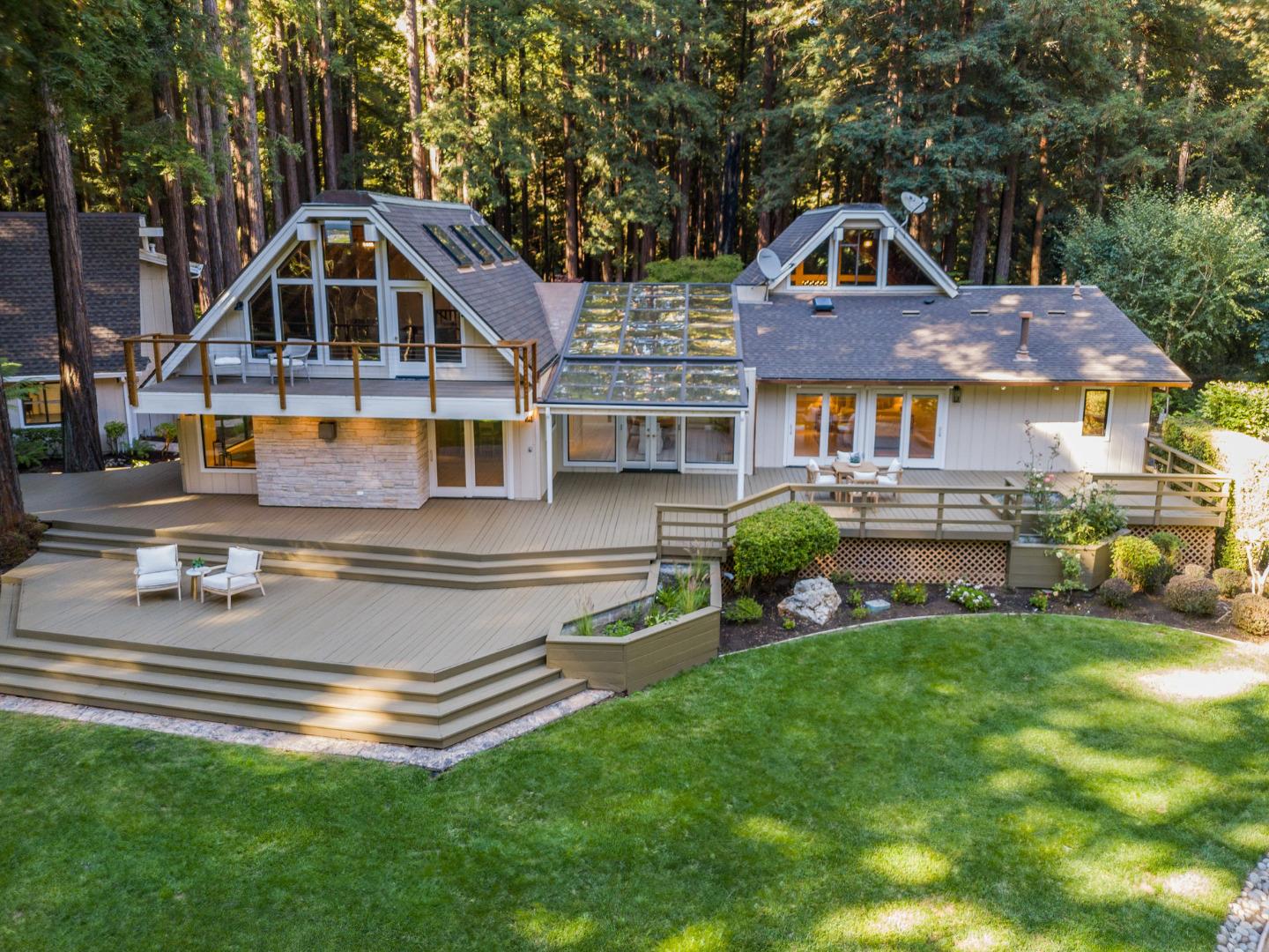 1695 Aptos Creek Road Aptos, CA 95003 - Photo 30 of 76 a front view of a house with a yard table and chairs