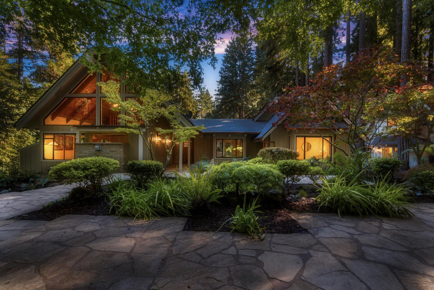 1695 Aptos Creek Road Aptos, CA 95003 - Photo 3 of 76 a view of a brick house with plants and large trees