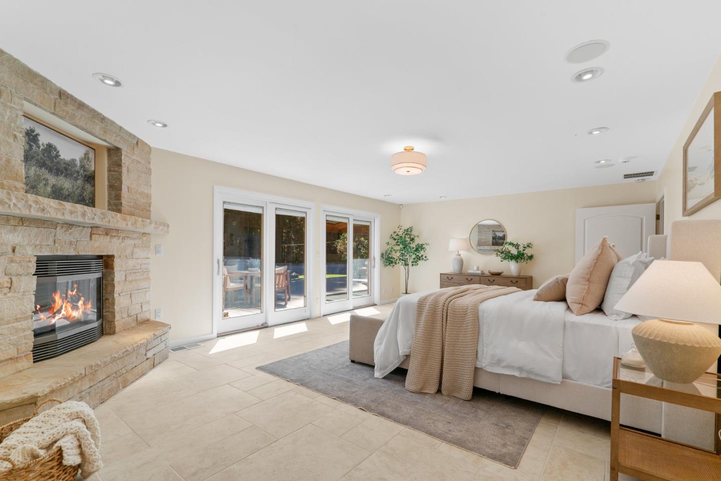 1695 Aptos Creek Road Aptos, CA 95003 - Photo 33 of 76 a spacious bedroom with a bed and a fireplace