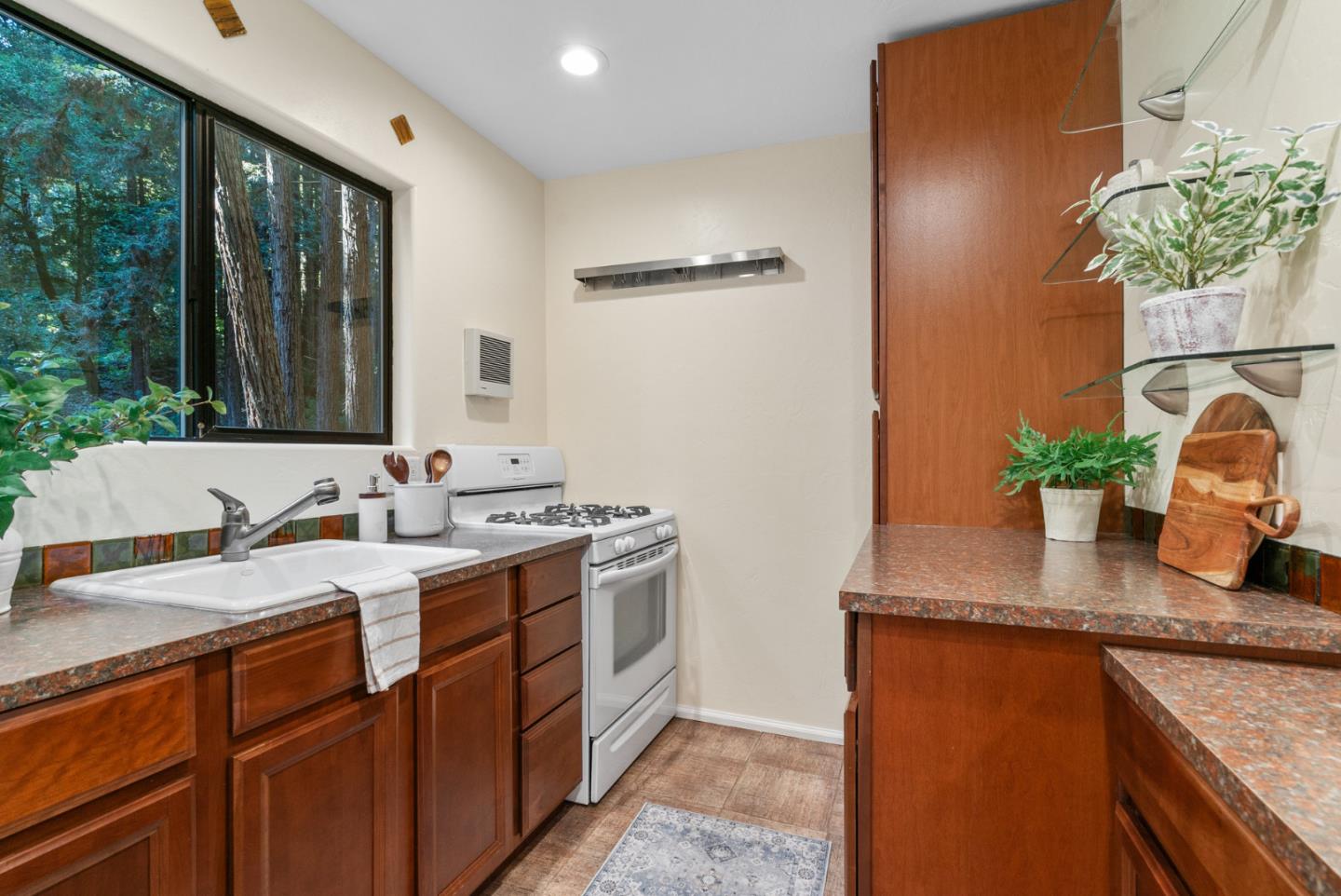 1695 Aptos Creek Road Aptos, CA 95003 - Photo 53 of 76 a bathroom with a granite countertop sink a mirror and a shower