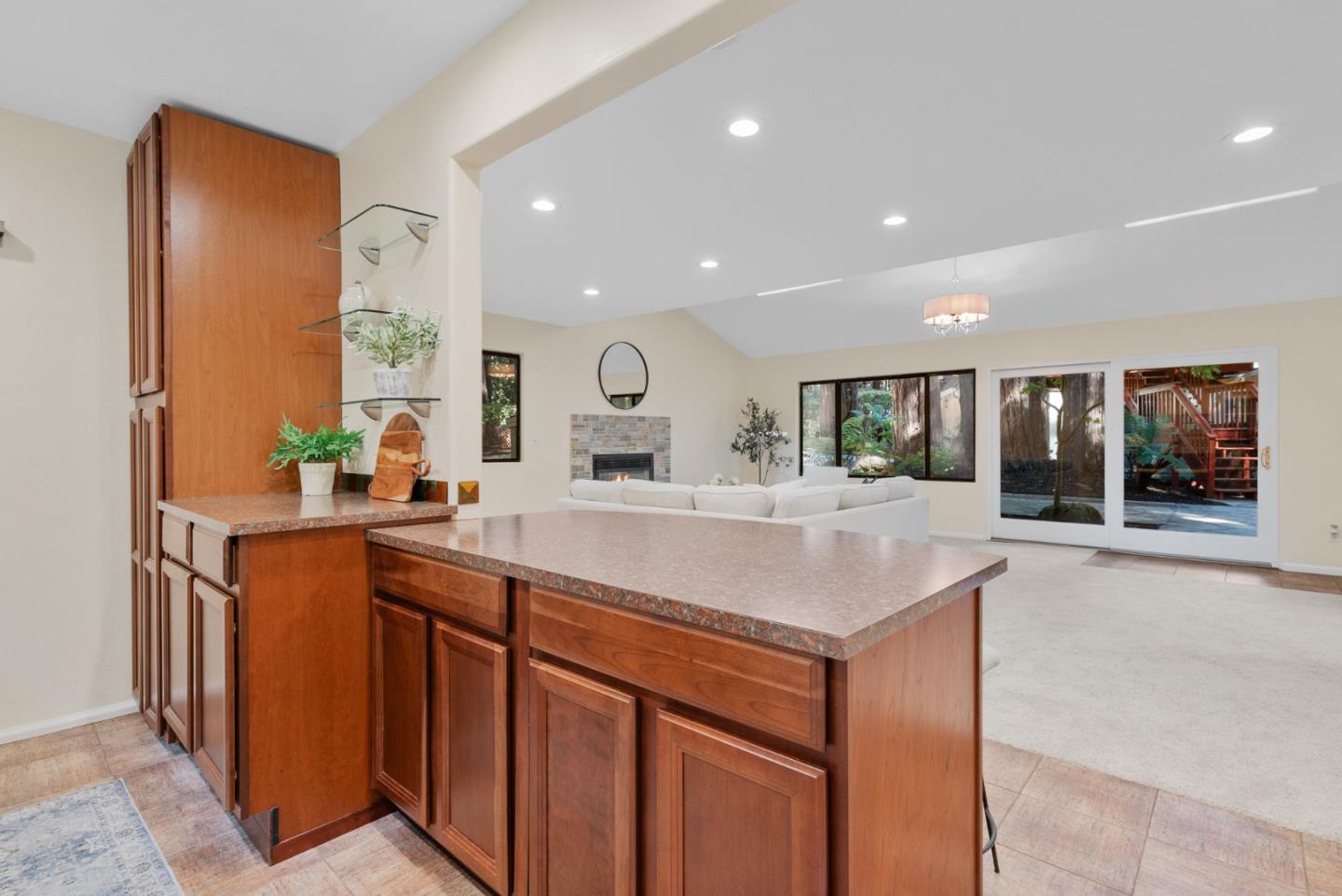 1695 Aptos Creek Road Aptos, CA 95003 - Photo 54 of 76 a kitchen with kitchen island a sink and a refrigerator
