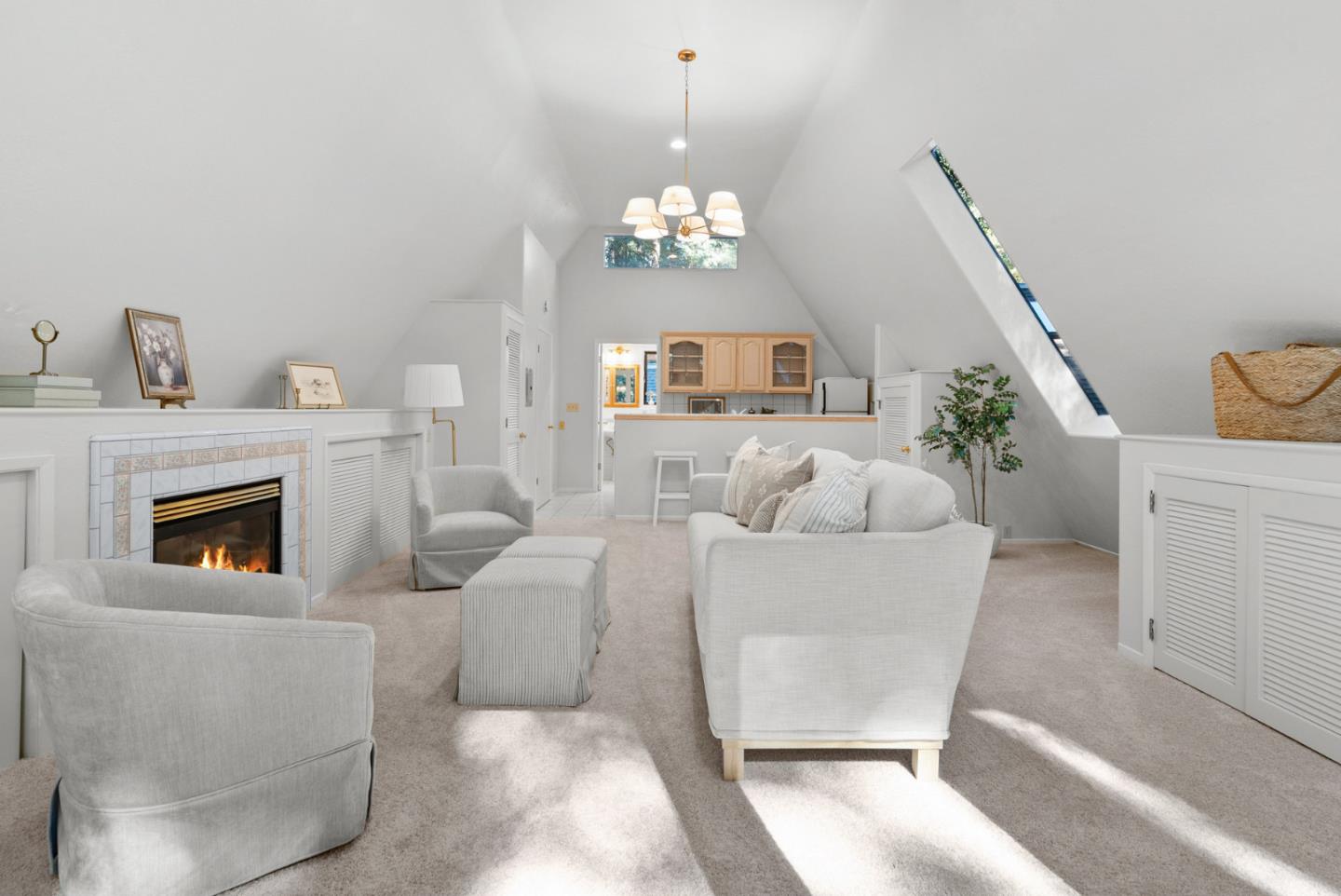 1695 Aptos Creek Road Aptos, CA 95003 - Photo 62 of 76 a living room with furniture a fireplace and a chandelier