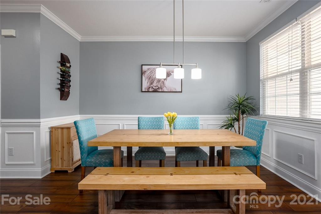 131 High Ridge Road Mooresville, NC 28117 - Photo 12 of 40 a view of a dining room with furniture window and wooden floor