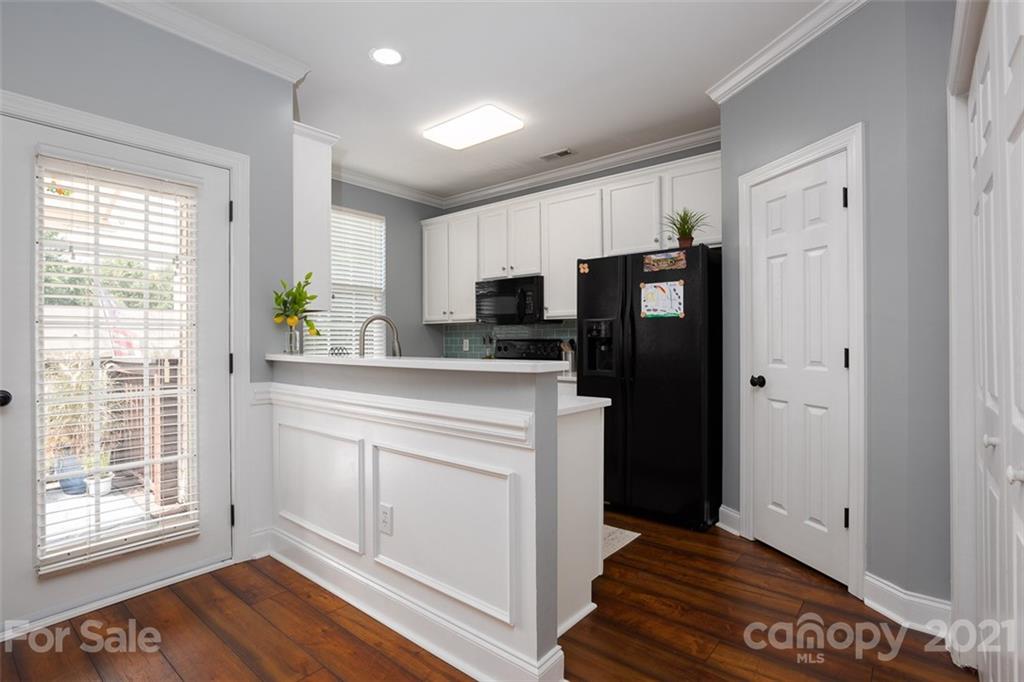 131 High Ridge Road Mooresville, NC 28117 - Photo 14 of 40 a kitchen with stainless steel appliances a refrigerator sink and stove