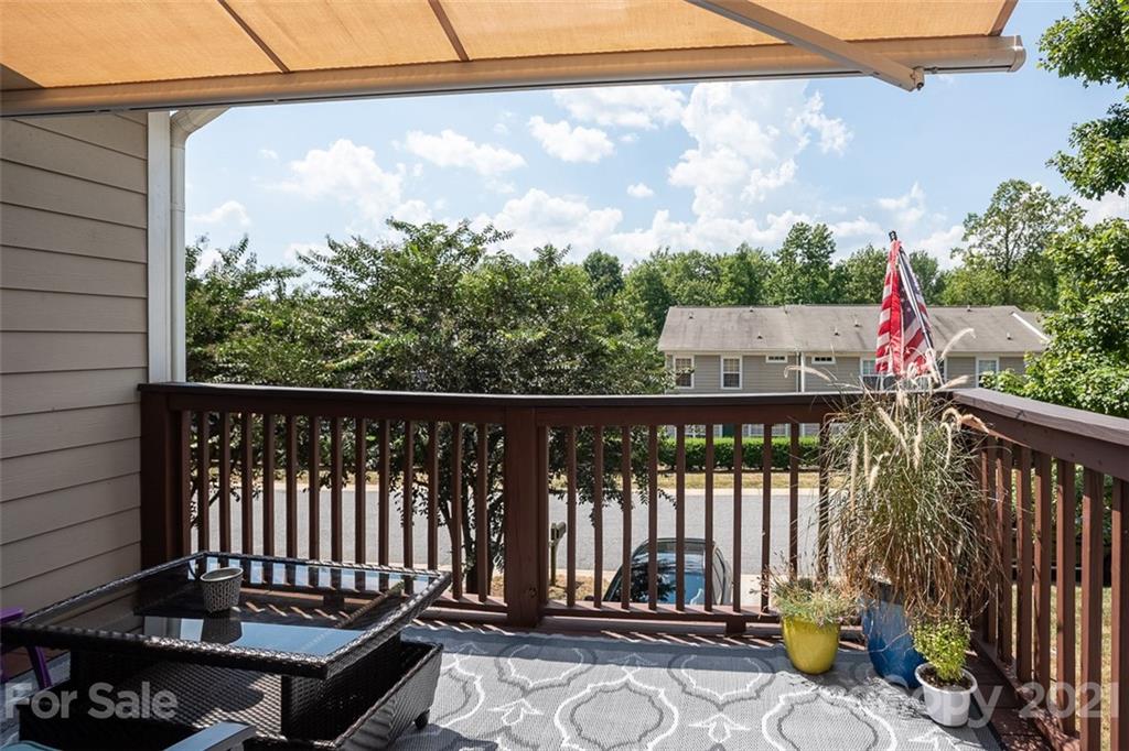 131 High Ridge Road Mooresville, NC 28117 - Photo 18 of 40 a view of a balcony with wooden fence