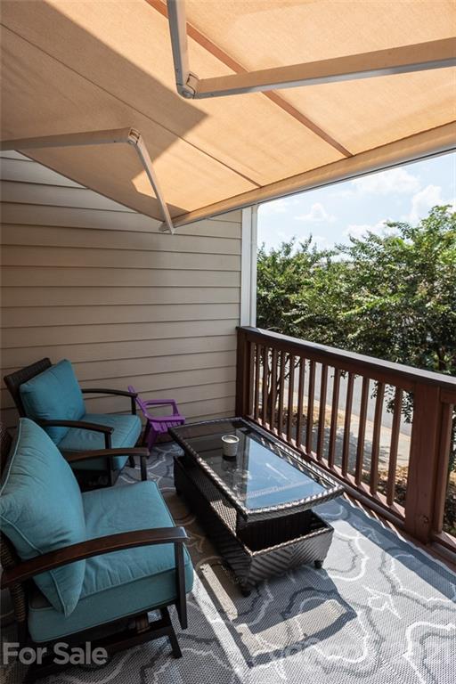 131 High Ridge Road Mooresville, NC 28117 - Photo 20 of 40 a roof deck with wooden floor and outdoor seating