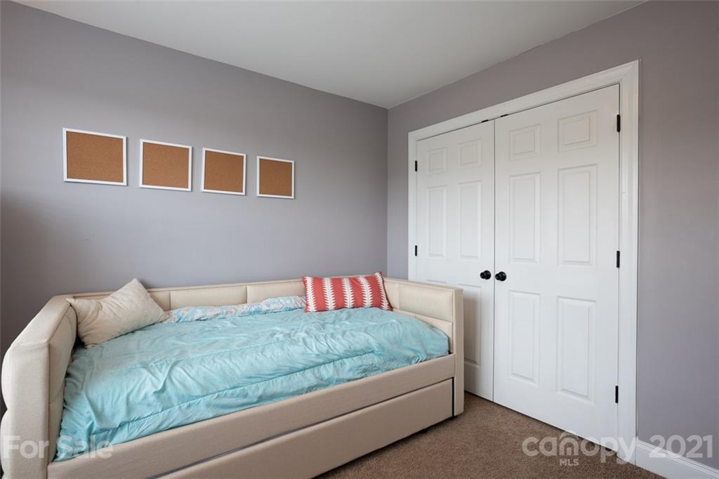 131 High Ridge Road Mooresville, NC 28117 - Photo 22 of 40 a bedroom with a bed and a window