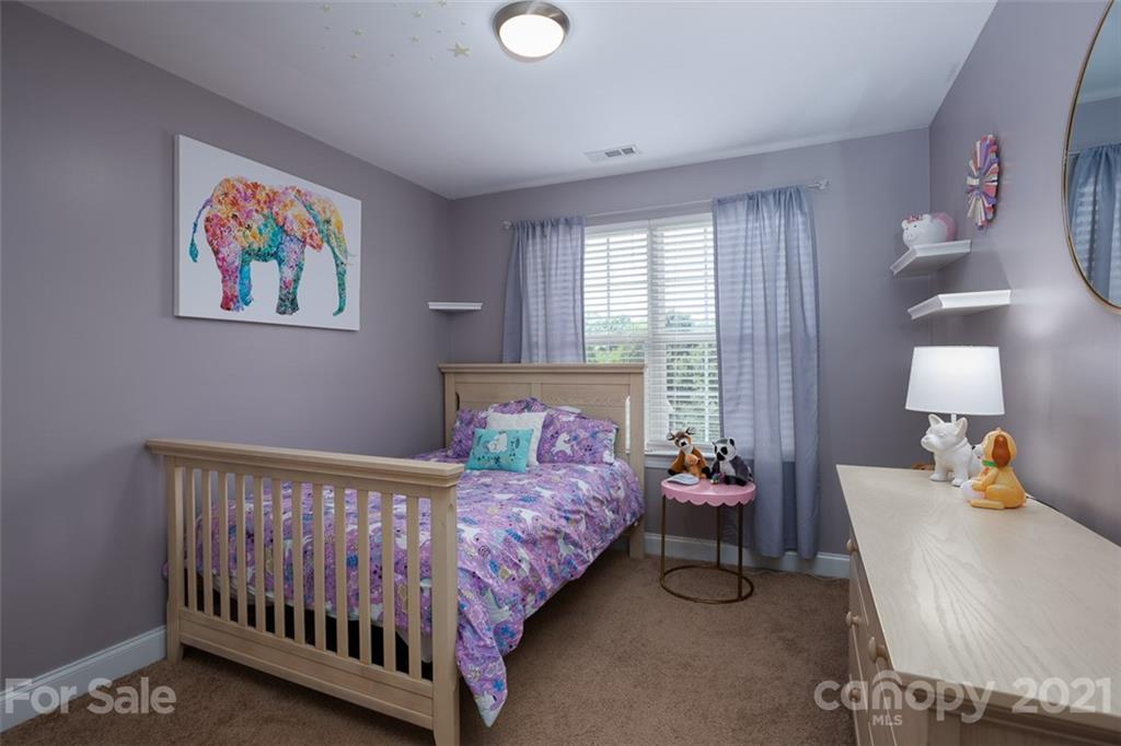 131 High Ridge Road Mooresville, NC 28117 - Photo 23 of 40 a bedroom with a bed and window