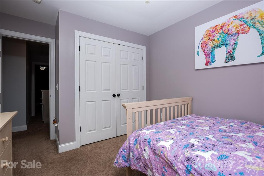 131 High Ridge Road Mooresville, NC 28117 - Photo 24 of 40 a bedroom with a bed and a baby crib