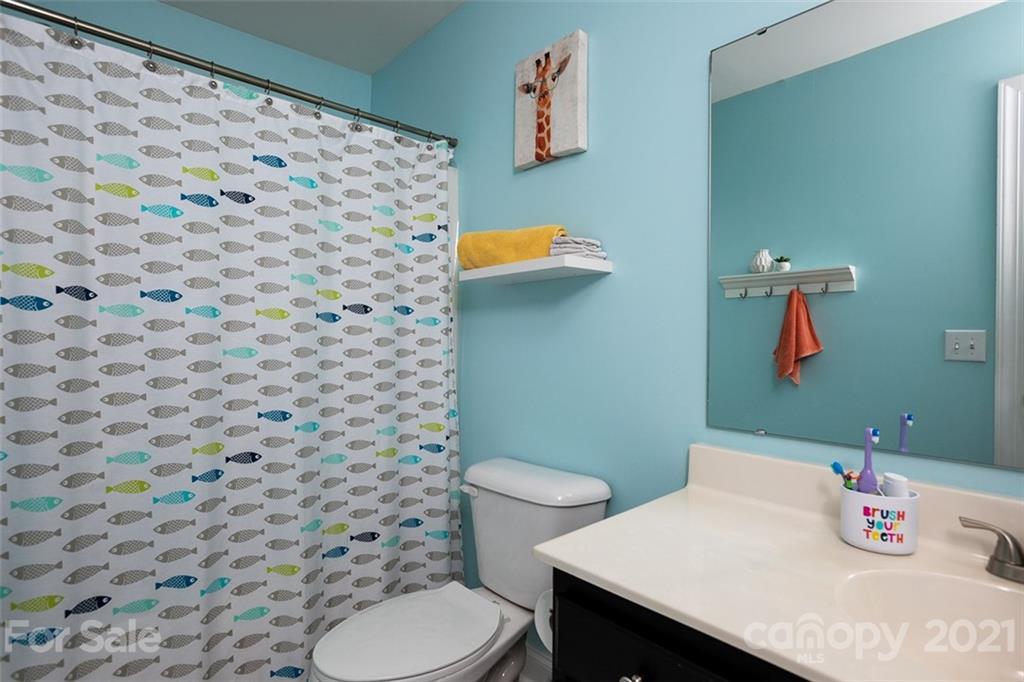 131 High Ridge Road Mooresville, NC 28117 - Photo 26 of 40 a bathroom with a sink and a toilet
