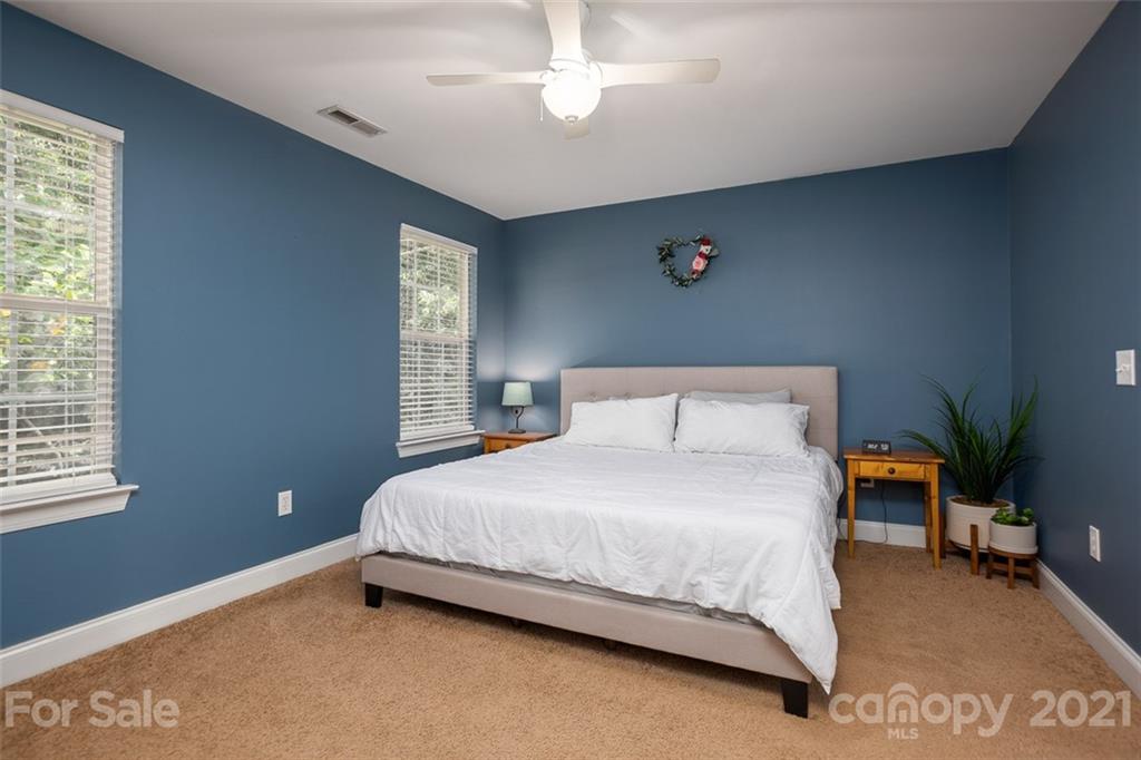 131 High Ridge Road Mooresville, NC 28117 - Photo 27 of 40 a bedroom with a bed and window