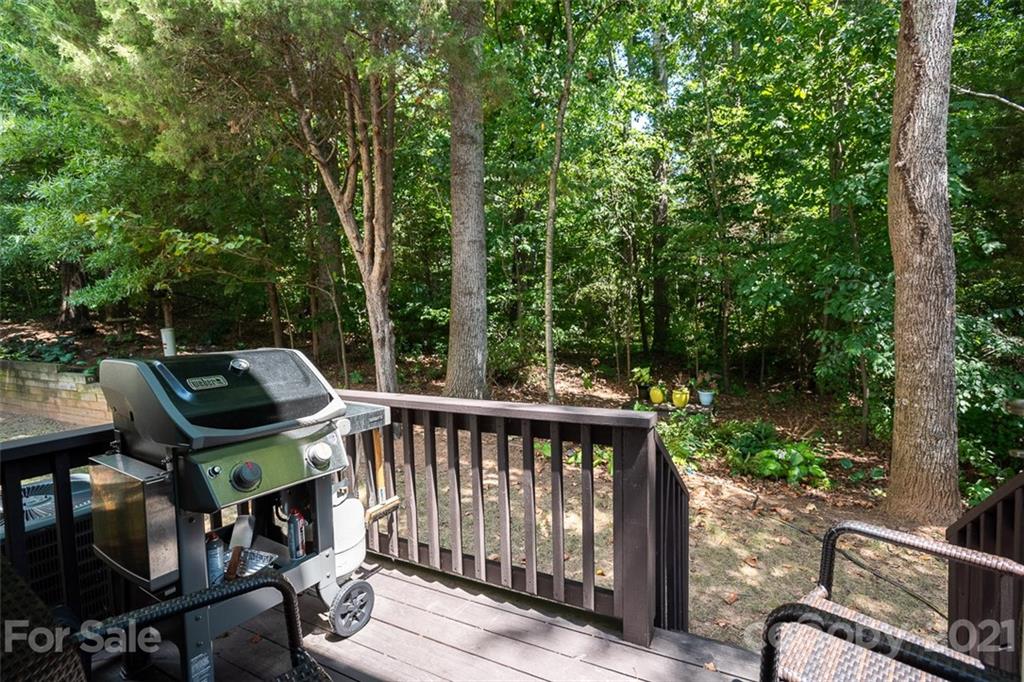 131 High Ridge Road Mooresville, NC 28117 - Photo 33 of 40 a view of a roof deck with wooden fence and trees