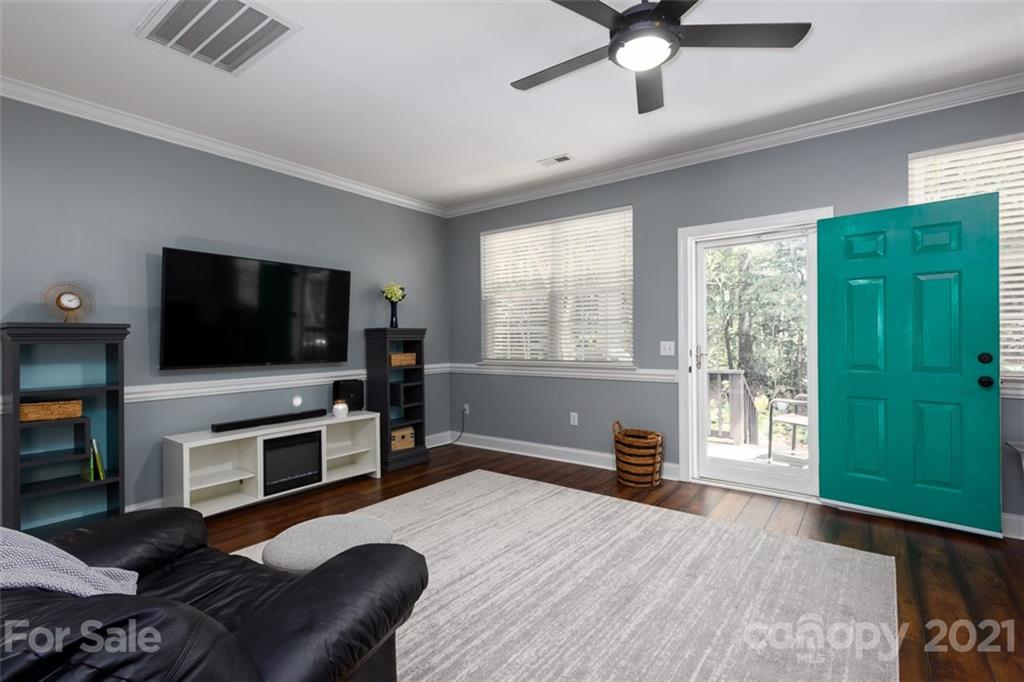 131 High Ridge Road Mooresville, NC 28117 - Photo 6 of 40 a living room with furniture and a flat screen tv