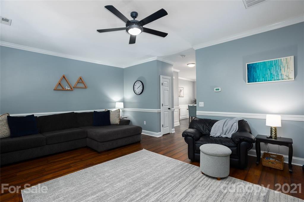 131 High Ridge Road Mooresville, NC 28117 - Photo 7 of 40 a living room with furniture and a wooden floor