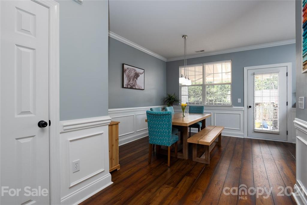 131 High Ridge Road Mooresville, NC 28117 - Photo 10 of 40 a view of a dining room with furniture window and wooden floor