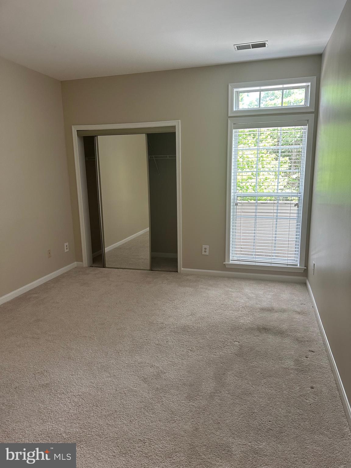 1324D Garden Wall Circle, Unit 306 Reston, VA 20194 - Photo 7 of 12 a view of an empty room with a window