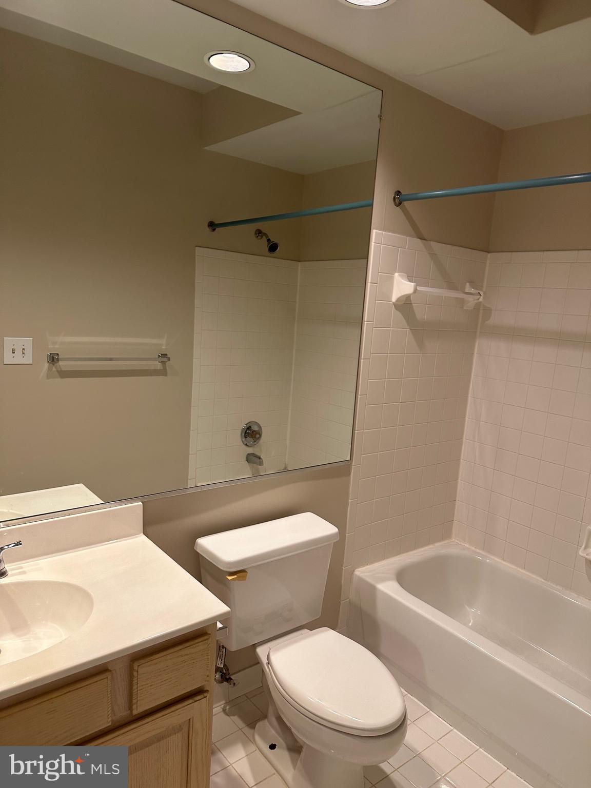 1324D Garden Wall Circle, Unit 306 Reston, VA 20194 - Photo 10 of 12 a bathroom with a sink a toilet and shower