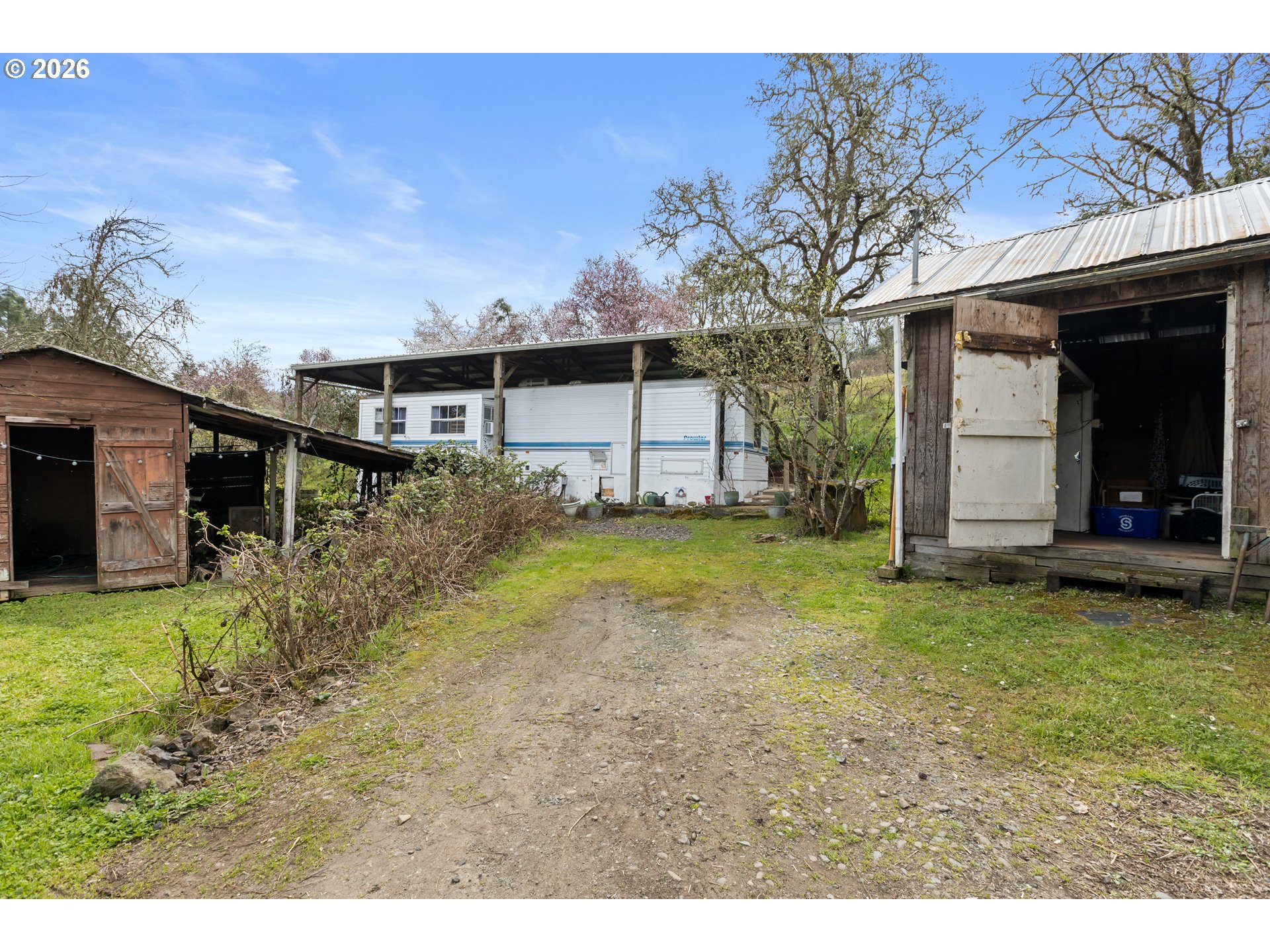 4178 Old Melrose Road Roseburg, OR 97471 - Photo 13 of 19 a view of a house with backyard and garden