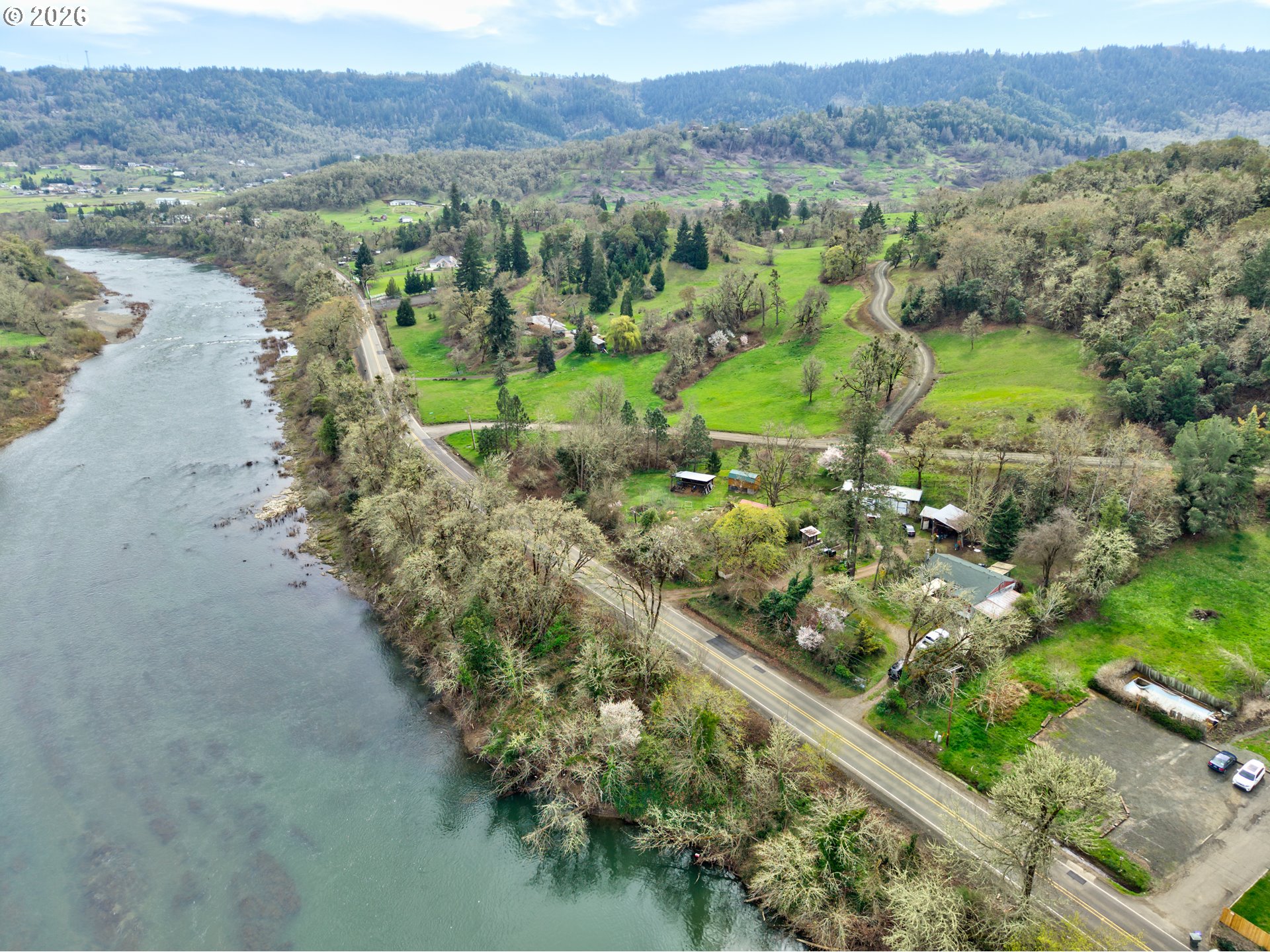 4178 Old Melrose Road Roseburg, OR 97471 - Photo 18 of 19 a view of a lush green hillside and houses