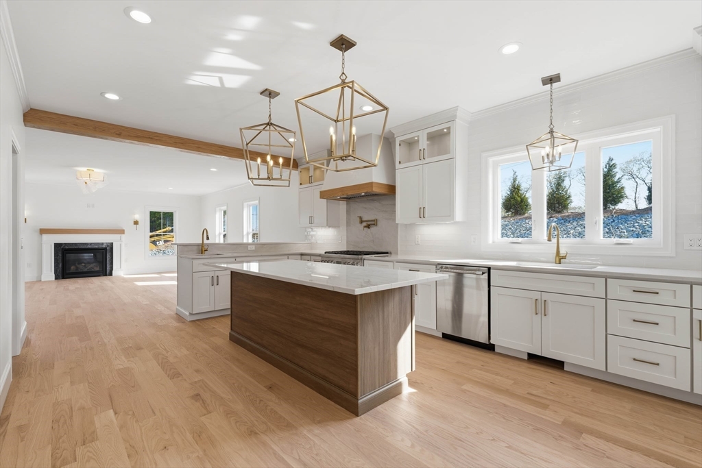 16 Couture Way Middleton, MA 01949 - Photo 6 of 36 a kitchen with stainless steel appliances granite countertop a stove and cabinets