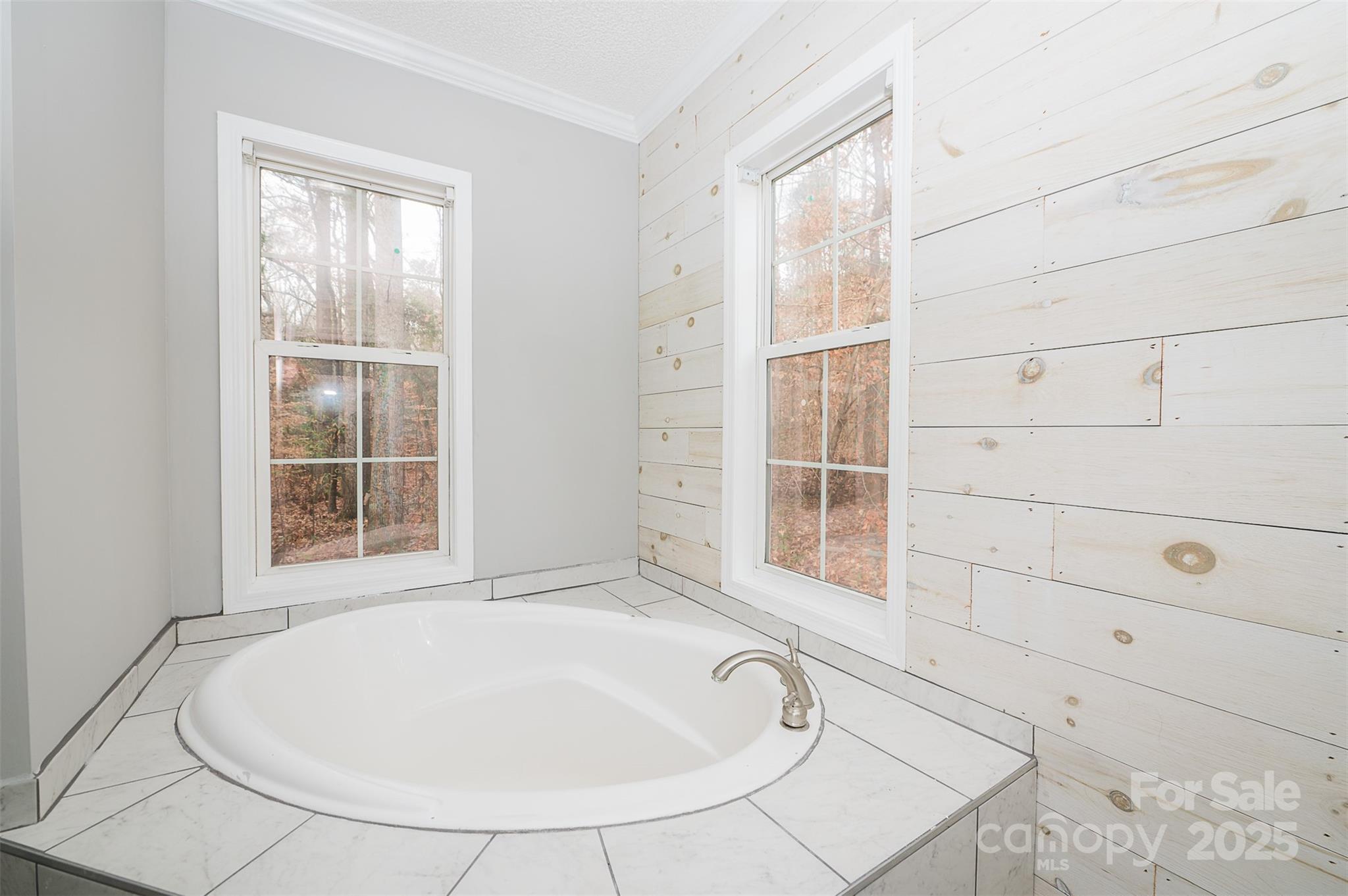 8226 Malibu Road Mount Pleasant, NC 28124 - Photo 20 of 44 a bathroom with a bathtub and next to a window