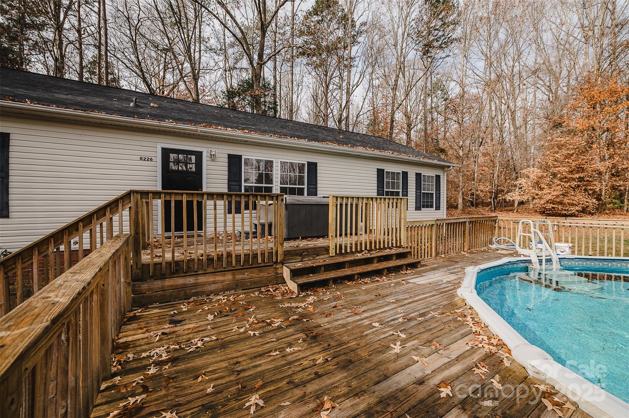 8226 Malibu Road Mount Pleasant, NC 28124 - Photo 2 of 44 a view of a house with wooden deck and furniture