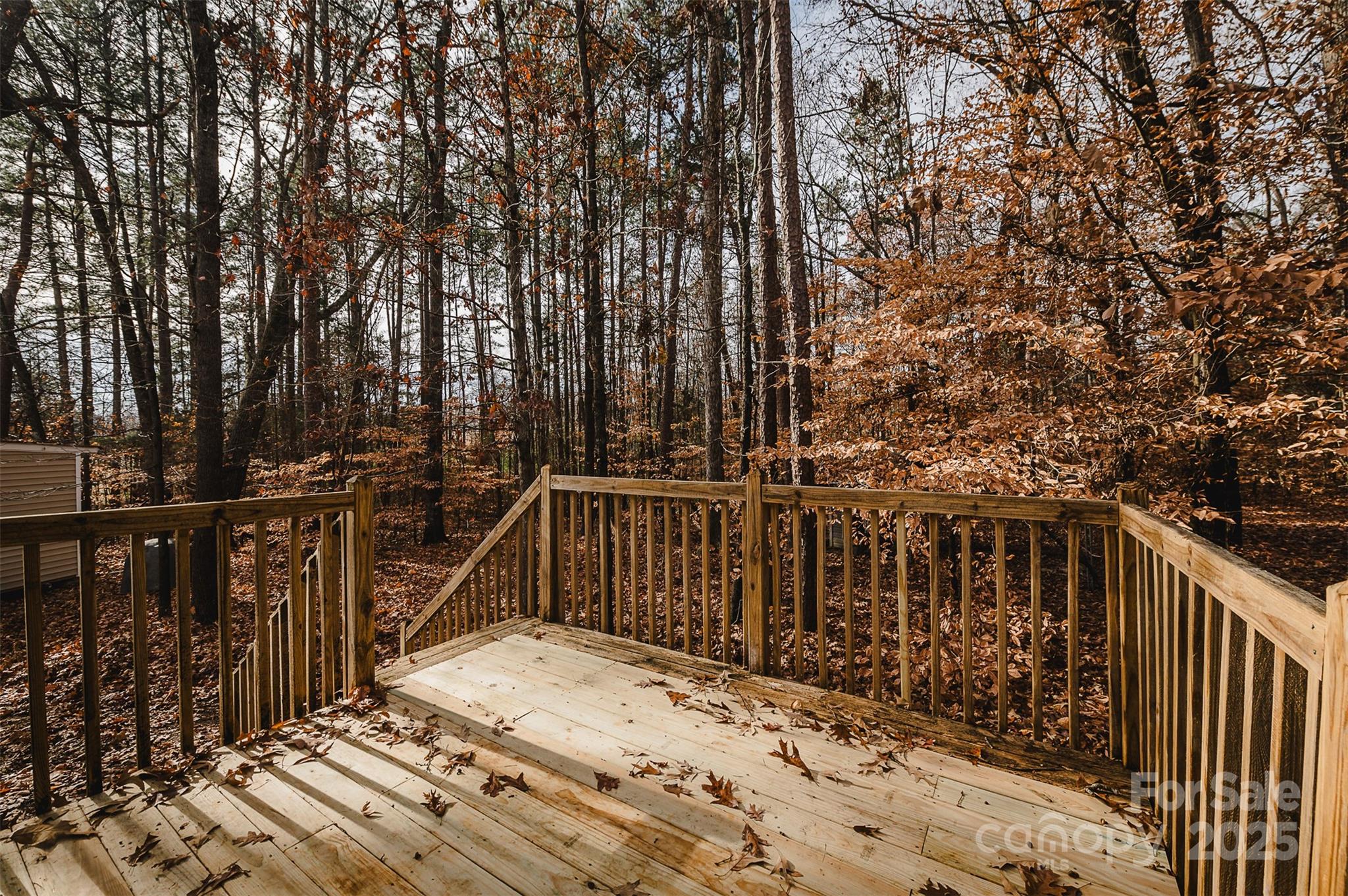 8226 Malibu Road Mount Pleasant, NC 28124 - Photo 32 of 44 a view of balcony with wooden floor and fence