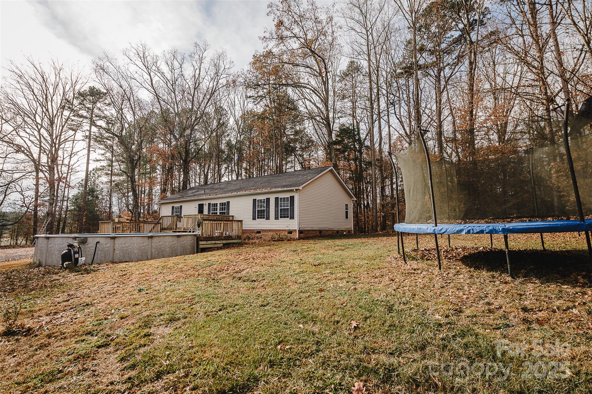 8226 Malibu Road Mount Pleasant, NC 28124 - Photo 43 of 44 a view of a house with a yard and sitting area