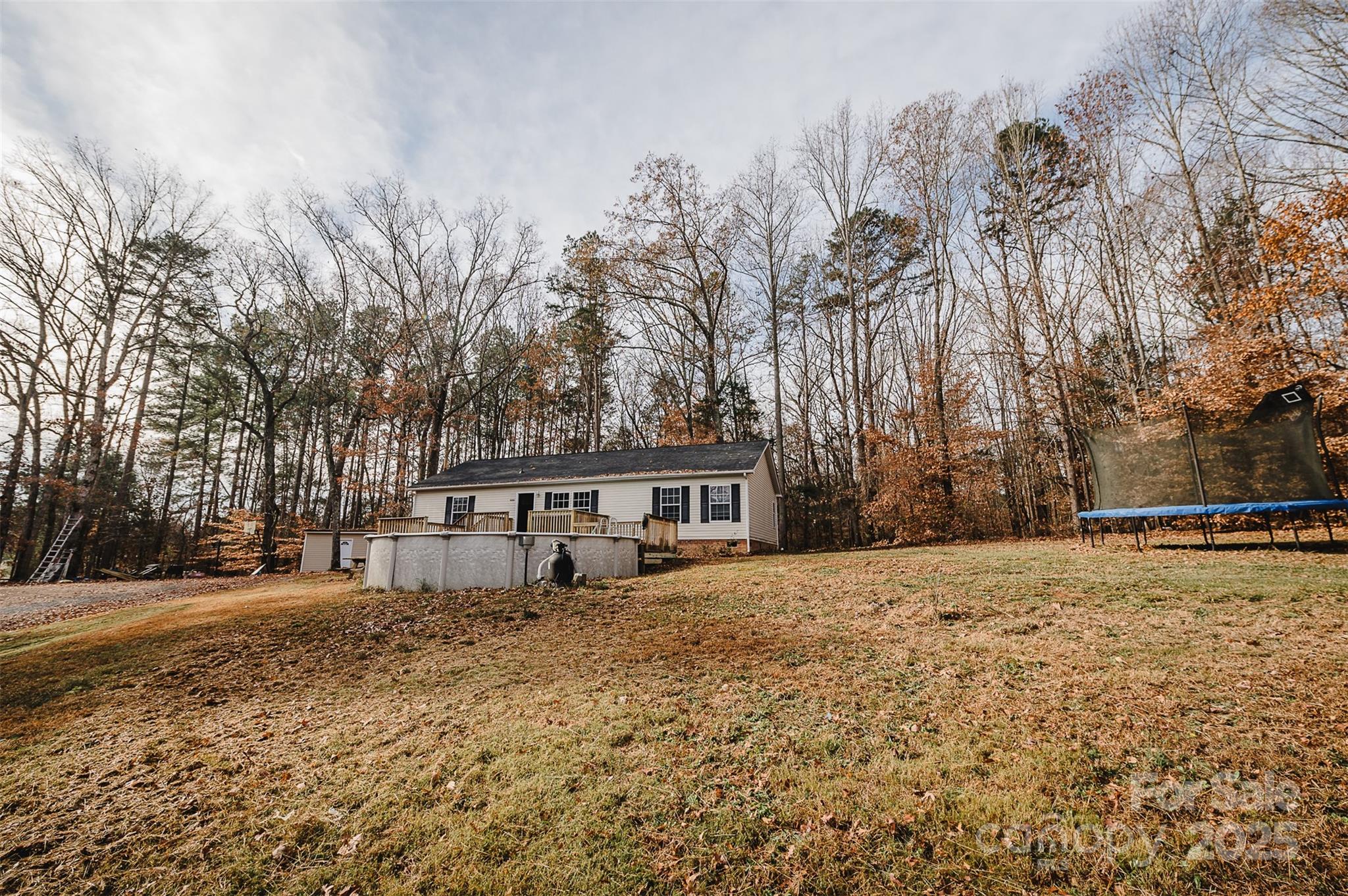 8226 Malibu Road Mount Pleasant, NC 28124 - Photo 44 of 44 a house with trees in front of it