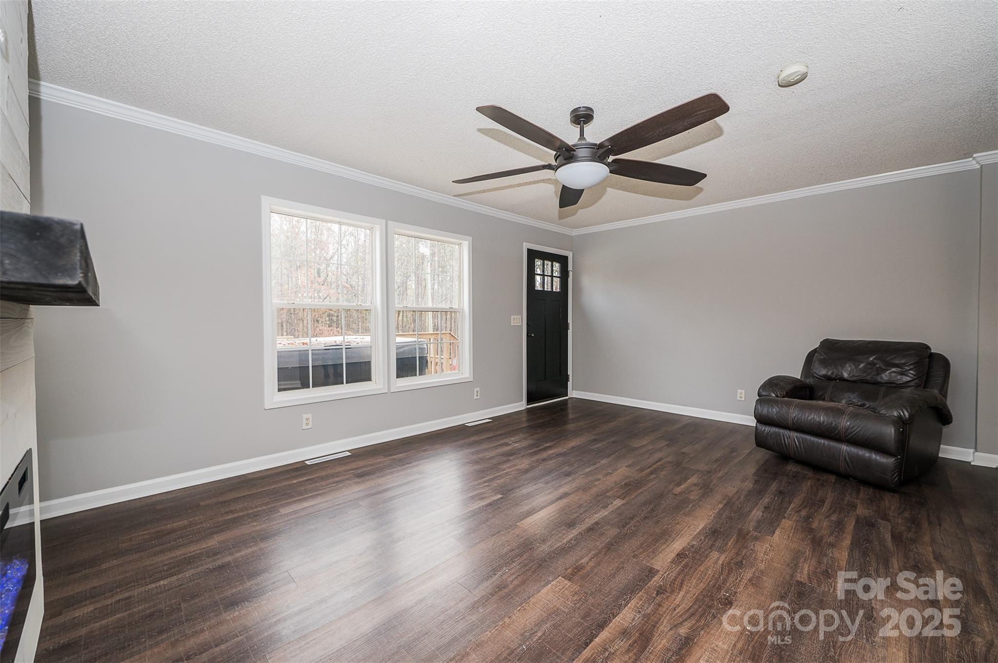 8226 Malibu Road Mount Pleasant, NC 28124 - Photo 8 of 44 a living room with wooden floor and a window