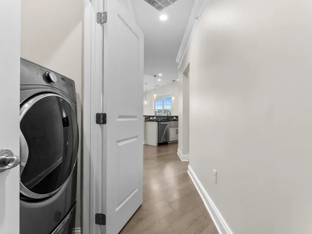a kitchen with refrigerator and cabinets