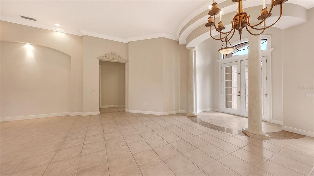 7134 Whitemarsh Circle Lakewood Ranch, FL 34202 - Photo 12 of 78 a view of an entryway with a chandelier