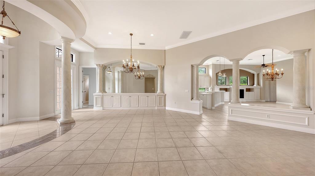 7134 Whitemarsh Circle Lakewood Ranch, FL 34202 - Photo 15 of 78 a view of a hallway with a chandelier