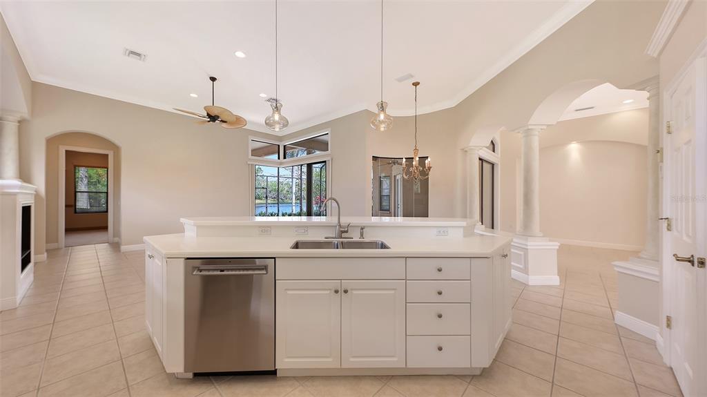 7134 Whitemarsh Circle Lakewood Ranch, FL 34202 - Photo 20 of 78 a spacious bathroom with a granite countertop sink a mirror and a